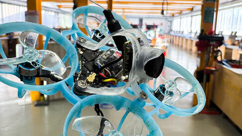 Drone flying through workshop