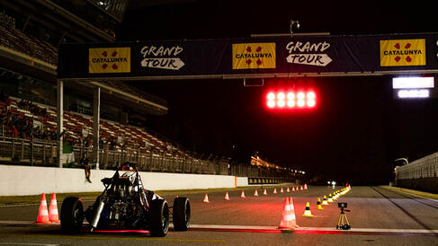 Full Blue Racing car at the start line at night