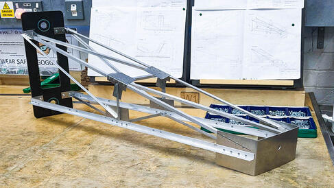 Offset Cantelever Truss build out of steel sheet and angle on a bench