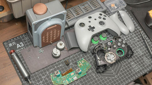 games controller disassembled on table