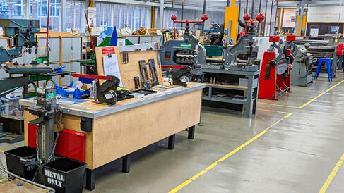 a workshop full of sheet metal working equipment