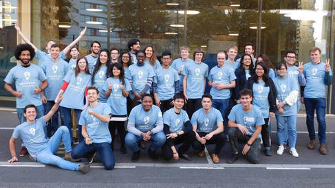 Team of engineernig students in blue T-Shirts