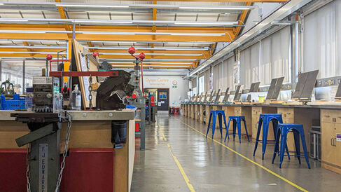 workshop with metalwork equipment and workbenches