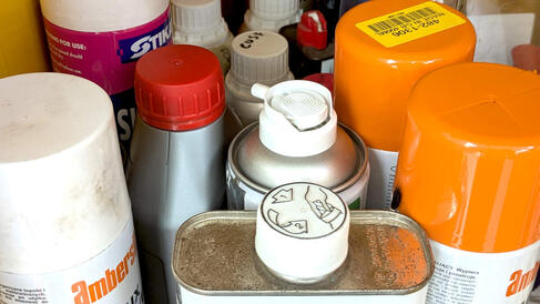 a close up of chemicals stored in a cupboard