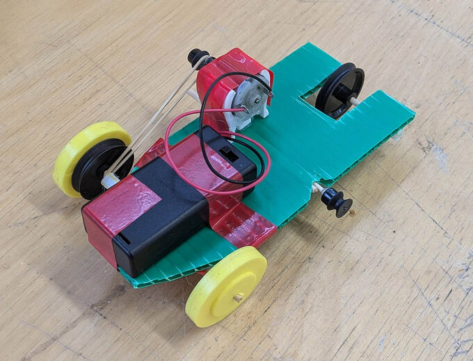 mini electric car made from kebab sticks and elastic bands