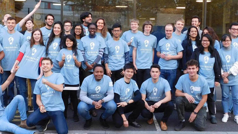 engineering students in blue t shirts